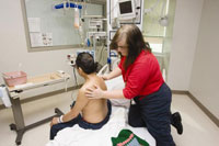 Massage therapist Alison Mitchinson tends to a patient at the Ann Arbor VA Medical Center. A study found that 97 percent of VA patients with chronic pain were open to trying massage. 