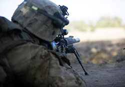 A Marine sniper aims at an insurgent during a firefight in Helmand province, Afghanistan, in 2010. VA psychologist Dr. Shira Maguen and colleagues are developing and testing a therapy that specifically addresses issues related to killing during war.