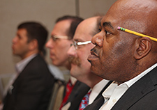 Dr. Ken Myrie (foreground) of VA's Office of Research and Development listens to a presentation during a July 2015 meeting of Career Development awardees. 