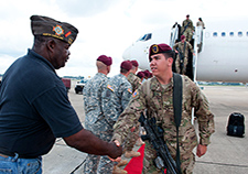 Roland Rochester, left, of the Veterans of Foreign Wars greets Army paratroopers as they return from Afghanistan to Fort Bragg in 2012.