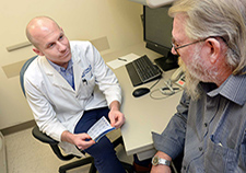 
Dr. Matthew Crowley meets with diabetes patient Jon Morris at the Durham VA. Crowley's team is studying how to use telehealth to boost care for Veterans with diabetes whose condition has not responded to standard clinic-based care.  