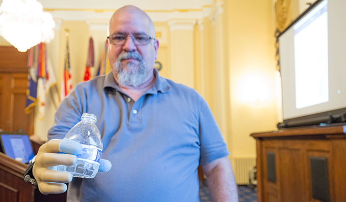 Research participant Keith Vonderhuevel demonstrated a prototype artificial hand, featuring a sense of touch, at a 2017 Capitol Hill event sponsored by Friends of VA Medical Care and Health Research. (Photo by Eugene Russell)  