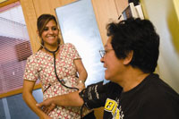 Veteran Gladys Colon (right) is seen at a VA clinic geared to Veterans coping with homelessness.