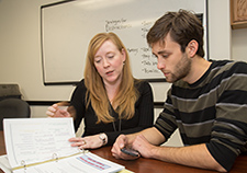 Dr. Amy Jak and research assistant Mark Sanderson-Cimino review the SMART-CPT protocols.