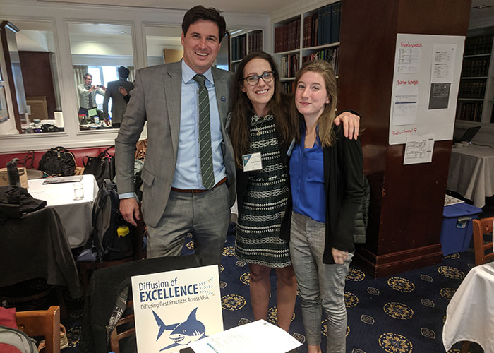 From left: Blake Henderson, acting director of the Diffusion of Excellence program, poses with Rachel Hudak and Arielle Willet at the 2019 VHA Shark Tank Competition. 
 