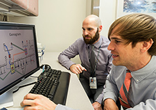 Daniel Wyers (left), a nurse practitioner student at VA and UAB,  shows instructor Chance Nicholson an informatics tool he is studying to help incorporate patients' family histories into their electronic health records.  