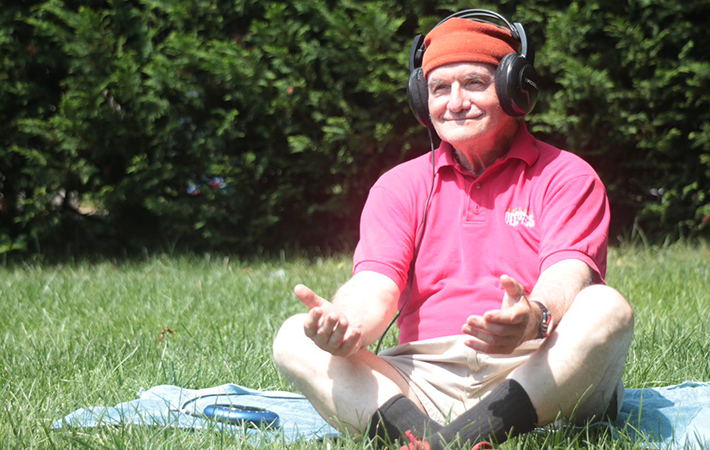 Marty Sigel, a 77-year-old Navy Veteran, tries out some meditation on a July day in Baltimore. (Photo by Mitch Mirkin) 