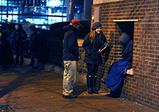 VA outreach workers speak with a Veteran during the 2015 Point-in-Time Homeless Count in Baltimore. <em>(Photo by Robert Turtil)</em>>