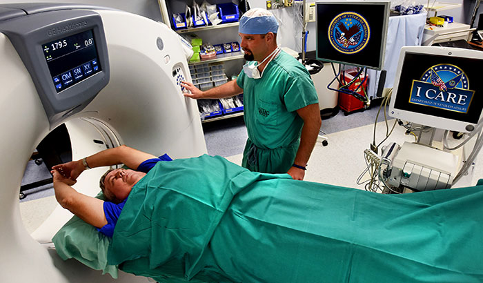 Joshua Cooper prepares to administer a CT scan at the Central Arkansas Veterans Healthcare System. A VA study has found that smokers are often confused about the actual benefits and limitations of low-dose CT scans to screen for lung cancer. (Photo by Jeff Bowen, for illustrative purposes only.)  