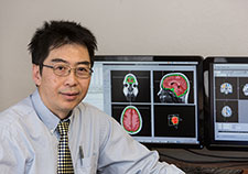 Dr. Mingxiong Huang is a neuroscientist with VA and the University of California, San Diego. <em>(Photo by Kevin Walsh)</em