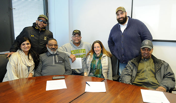 Jesse Brown (center) and Chris Murray (second from right) are part of a suicide-prevention group led by Drs. Marianne Goodman (third from right) and Kalpana Nidhi Kapil-Pair (left) at the Bronx VA Medical Center.