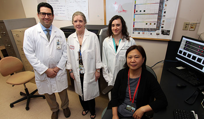 Dr. Achsah Keegan (second from left) and colleagues Dr. Amit Golding, Molly Hritzo, and Dr. Hongjuan Gao are looking at how immune cells respond to house dust mites. The work could yield wider insight on the respiratory problems affecting many Iraq and Afghanistan Veterans. (Photo by Mitch Mirkin)  