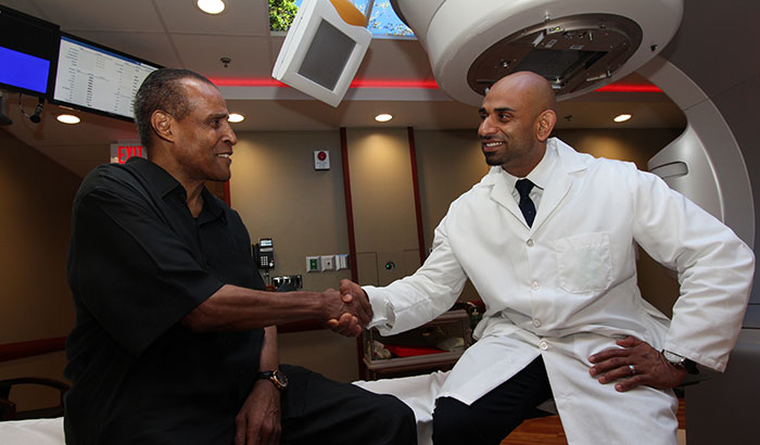 Clarence Massey (left) received treatment for his prostate cancer at the Brooklyn campus of the VA NY Harbor Healthcare System. He is seen here with radiation therapist Nader Girgis, who was part of his treatment team. (Photo by Mitch Mirkin)   