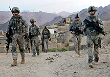 U.S. soldiers depart Forward Operating Base Baylough, Afghanistan, to conduct a patrol in June 2010.