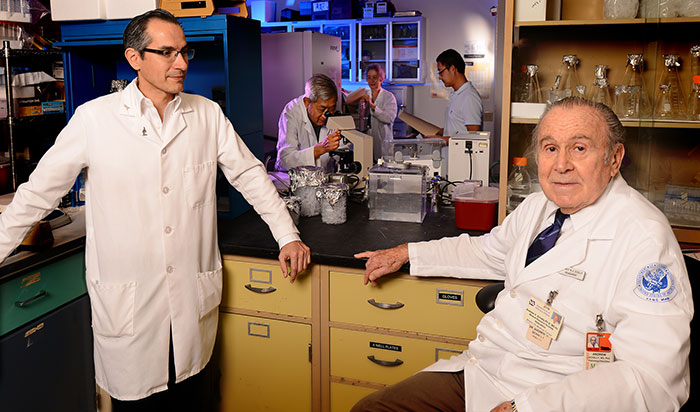  Dr. Andrew Schally (right) is seen in this 2013 Miami VA photo with his former lab manager, Ricardo Rincon. (Photo by Larry Gilstad) 
