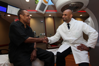 Clarence Massey visits with radiation therapist Nader Girgis, who was part of his treatment team at the Brooklyn campus of the VA NY Harbor Healthcare System.
