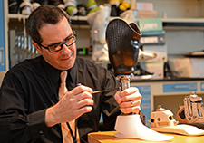     Dr. Andrew Hansen of the Minneapolis VA Healthcare System has led efforts to develop a prosthetic foot that works with a variety of shoe styles, including
    high heels. (Photo by April Eilers)