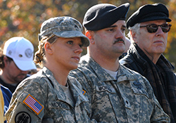     Army Sgt. Danielle Modglin, left, and Spc. Ricky Morris take part in a Veterans Day ceremony in Washington, D.C., in 2008. The Soldiers, who were wounded
    in Iraq, were recovering at Walter Reed Army Medical Center. 