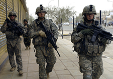 U.S. Army soldiers join Iraqi personnel on a search for IEDs and illegal firearms in Baghdad in 2008. A VA team that combined data from 33 studies published between 2007 and 2013 found an average PTSD prevalence rate of 23 percent among Iraq and Afghanistan Veterans.