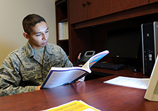 An airman uses a happy light at Ellsworth Air Force Base in 2014. A clinical trial by VA researchers and colleagues has found that light therapy and cognitive behavioral therapy are equally effective for seasonal affective disorder.