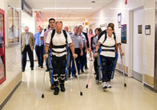   Research participants try out the ReWalk at the Bronx VA Medical Center during a visit by Lt. Gen. Thomas Travis, Surgeon General of the U.S. Air Force.
  <em>  (Photo by Lynne Kantor)</em>