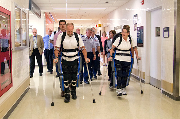 Research participants try out the ReWalk at the Bronx VA Medical Center during a visit by Lt. Gen. Thomas Travis, Surgeon General of the U.S. Air Force.
