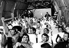 Former POWs cheer as they leave North Vietnam to return home in 1973. (Photo: USAF) 