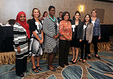  VA staff pose for a photo at the 2014 VA Women Veterans'' Health Services Research Conference. More than 100 providers, researchers, and policymakers attended the conference, which aimed to promote partnership in women-centered VA research. (Photo by Robert Turtil)