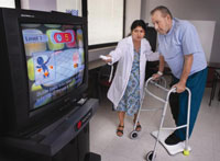 Veteran Jerry Izzard receives an explanation of the Wii-Fit from Dr. Kalpana Padala at the Central Arkansas Healthcare System's North Little Rock facility.