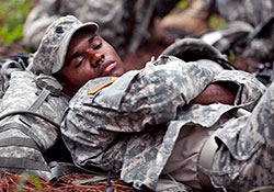 Army Spc. Jevon Daurbigny takes advantage of downtime between events to catch up on some sleep during the 2012 Best Warrior Competition at Fort Benning, Ga.