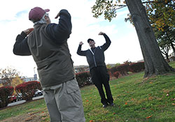   Vietnam Veteran Stan Fisher takes part in a qigong class led by Dr. Mike Basdavanos on the campus of the Washington, DC, VA Medical Center. The class is offered through the siteâ€™s War-Related Illness and Injury Study.  