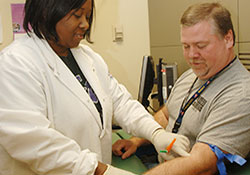 Blood tests for cholesterol levels take place millions of times each day in U.S. medical offices. Under new guidelines, doctors are now advised to focus less on specific numerical targets for prescribing statin drugs to lower LDL cholesterol. Here, a Veteran gets his blood drawn at the Central Arkansas VA Healthcare System.