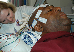 EEG technician Susan Hayes administers testing to an epilepsy study participant at the Durham VA Medical Center. 