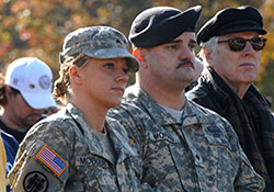     Army Sgt. Danielle Modglin, left, and Spc. Ricky Morris take part in a Veterans Day ceremony in Washington, D.C., in 2008. The Soldiers, who were wounded
    in Iraq, were recovering at Walter Reed Army Medical Center.
