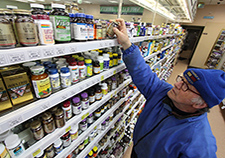  Navy Veteran Marty Sigel peruses the vision supplements at a Baltimore health food store.