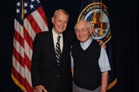 During VA National Research Week 2009, Dr. Thomas Starzl (left) shares a warm moment with former patient Bob Phillips, for whom he performed a kidney transplant in the early 1960s. 