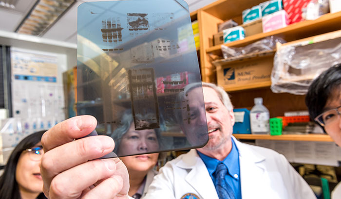  The lab of Dr. W. Timothy Garvey (holding slide) in Birmingham is one of the nation’s leading sites for diabetes research.  (Photo by Joe De Sciose)