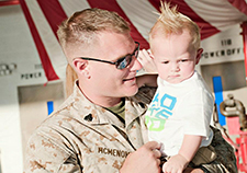 Nick McMenomy greets his son Junior upon his return home from a 31st Marine Expeditionary Unit deployment. (Photo courtesy of Nick McMenomy)   