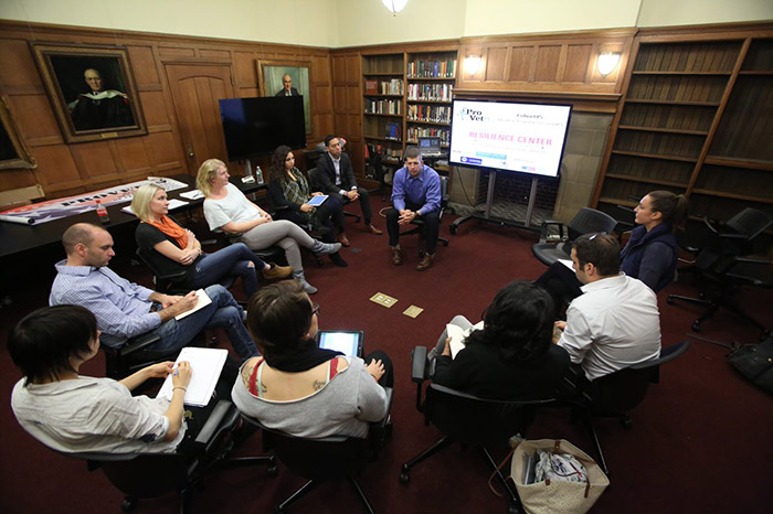 Dr. Joseph Geraci discusses his experiences transitioning out of the military as he certifies a group of people who have volunteered to help service members reintegrate into society. (Photo by Bruce Gilbert) 