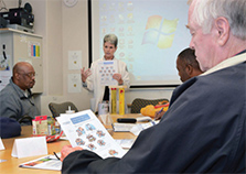 Nurse Adrienne Wagenblast teaches about diabetes during a shared medical appointment at the Durham VA.