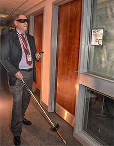 VA engineer David Ross models his RFID indoor wayfinding system.  