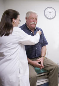 Veteran John Kane of Iowa City, seen here in a 2009 photo with nurse researcher Dr. Karen Clark Griffith, received an experimental treatment for prostate cancer that had spread beyond the prostate gland. All the men in the study had initially received surgery or radiation but required further treatment. (Photo by Michael Stenerson) 