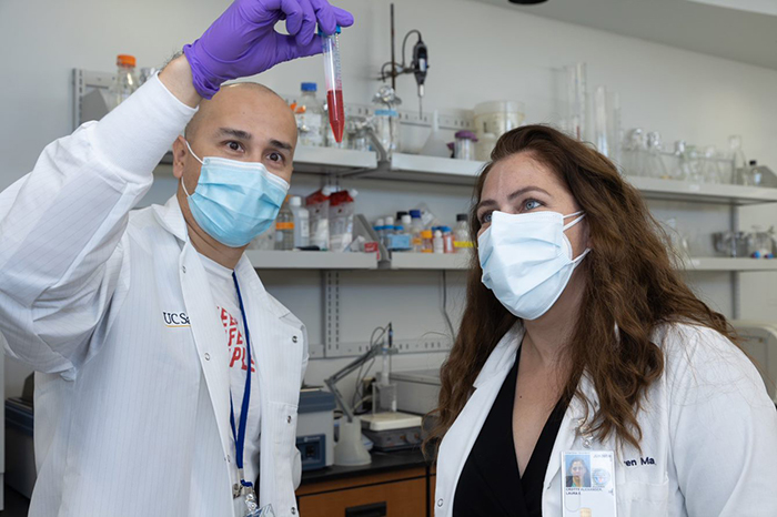 Dr. Laura E. Crotty Alexander (right) and Dr. Jorge Masso-Silva have led efforts to define the long-term consequences of e-cigarette use. (Photo by Kevin Walsh) 