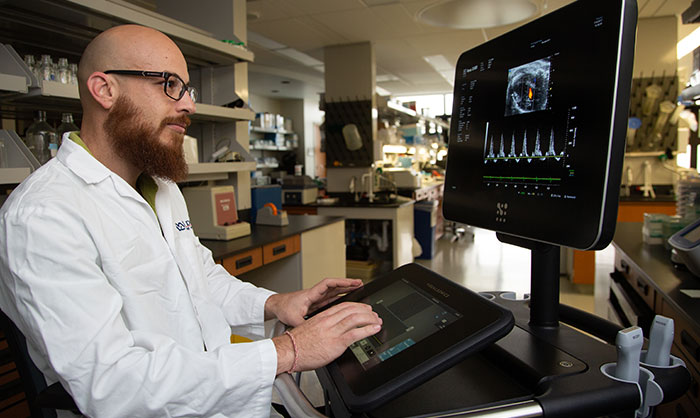 Dimosthenis Giamouridis is a research associate in Dr. Kirk Hammond’s lab at the VA San Diego Healthcare System and the University of California San Diego. The team has shown, in mice, that gene therapy can improve a diabetes-related heart ailment. (Photo by Kevin Walsh) 