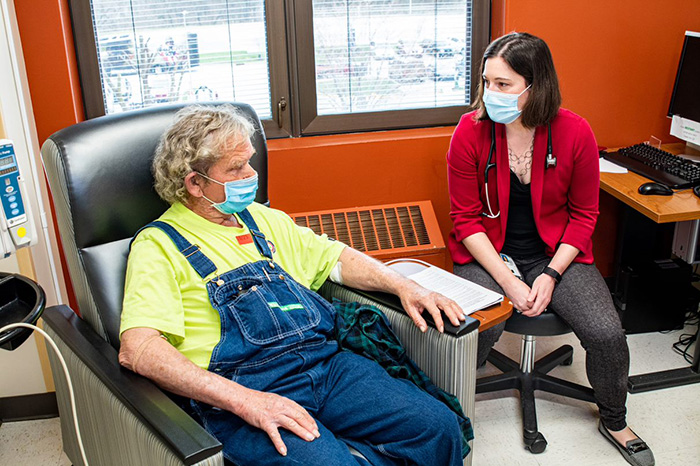 Pulmonary oncologist Dr. Catherine R. Sears meets with VALOR clinical trial participant Mr. Bobby Richardson.  (Photo by Mark Turney, Richard L. Roudebush VA Medical Center.)