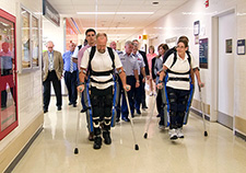 Research participants try out the ReWalk at the Bronx VA Medical Center during a visit by Lt. Gen. Thomas Travis, Surgeon General of the U.S. Air Force.