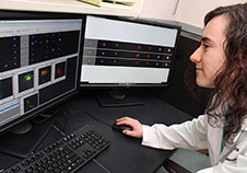 Molly Hritzo is part of Dr. Achsah Keegan's team. Here, she checks flow cytometry results to understand how immune cells called macrophages react to house dust mites. (Photo by Mitch Mirkin) 