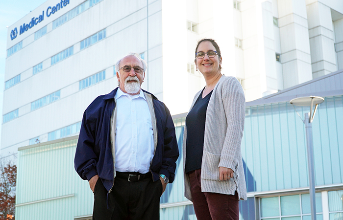 Navy Veteran Natale Stella (left), seen here with Dr. Lauren Beste, has lived with hepatitis B for two decades but has never experienced any symptoms. (Photo by Chris Pacheco)  