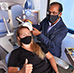 Dr. Prasad Padala simulates repetitive transcranial magnetic stimulation for mapping the brain of a research assistant at the Central Arkansas VA, Ashlyn Jendro. She's holding her thumb up to indicate the twitching caused by the pulses. (Photo by Jeff Bowen) 