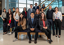 Dr. Andrew A. Pieper (standing, center, with blue suit), the senior author of the study, is a psychiatrist at the Cleveland VA. Here, he's with his lab team at the Harrington Discovery Institute in Cleveland. (Photo courtesy of Pieper lab)